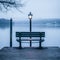 a bench sitting on a dock by a body of water