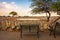 Bench at the waterhole of Okaukuejo Campsite in Etosha National Park, Namibia