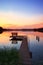 Bench on a wooden pier at sunset, Lipie Lake in Dlugie Village, Poland