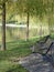 Benches on lake shore in park
