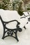 Benches in the park covered with snow, cold weather concept