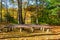 Benches and a rustic altar create an outdoor chapel with a beautiful view