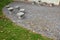 Benches in the shape of mushrooms made of solid carved stone. connection of block and stone slabs, for paving near the house. chai