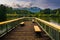 Benches on a small pier and view of Table Rock at Lake Oolenoy,