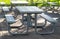 Benches and tables in the public park on the green meadow on a sunny day. Great for many people for the birthday party and