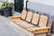 Benches with wicker straw pillows on the street