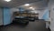 Benches with wooden shelves in light empty locker room