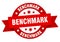 benchmark round ribbon isolated label. benchmark sign.