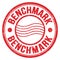 BENCHMARK text written on red round postal stamp sign