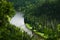 Bend of the mountain river in woodland in Siberia