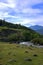 The bend of a swift river flowing along the hills and the road. Altai, Siberia, Russia. Landscape