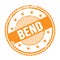 BEND text written on orange grungy round stamp