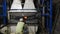 Bending tempered glass. The worker bends the glass in the furnace.