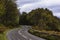 Bendy, country road in Scottish highlands in autumn