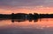 Benedictine monastery with twin spires, water reflection, in the