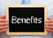 Benefits - Manager holding chalkboard with text