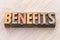 Benefits word abstract in wood type