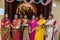 Bengali married women in white sari playing sindoor or sindur khela, traditional Bengali ritual of applying vermilion to faces,