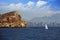 Benidorm island and sailboat close to the beach of Benidorm city.