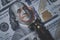 Benjamin Franklin face from USD dollar banknote with stamping debt wording