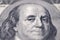 Benjamin Franklin on hundred dollars banknote. Selective focus on eyes