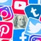 Benjamin Franklin hundred dollars bill portrait with printed logo of many social networks. Facebook Instagram Youtube Tumblr