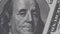 Benjamin Franklin on one hundred dollars bill slow rotating. Dollars banknote, close up in 4K video