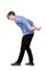 Bent down teenage guy keeps hands back as carrying an heavy invisible object on his shoulders isolated on white background.