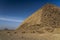 Bent Pyramid is an ancient Egyptian pyramid, the first, located at the royal necropolis of Dahshur outside of Cairo Egypt