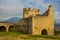 BERAT, ALBANIA: The strong upper corner tower of ancient Berat castle with walls, arches and stairways.