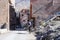 Berber man riding a horse in mountainous village in Atlas