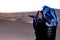 Berber praying at dawn in the ERG desert in Morocco