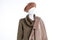 Beret and coat on female mannequin.