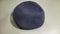 A beret made of navy-colored wool belonging to a soldier