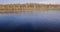 Berezinsky, biosphere Reserve, Belarus. Autumn landscape with lake pond river and beautiful birch forest on another