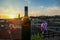 Bergamo - Bottle of wine with scenic sunset view of tower of  church Chiesa di Sant Alessandro della Croce