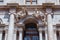 BERGAMO, ITALY - MAY 22, 2019: Sculptures on the facade of the Biblioteca Civica Angelo Mai library on the Piazza Vecchia st. in