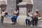 BERGAMO, ITALY - MAY 22, 2019: Unknown elderly people resting on The Civic Library stairs in the historical part of Bergamo on a