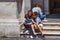 BERGAMO, ITALY - MAY 22, 2019: Unknown young people take a selfie on The Civic Library stairs in the historical part of Bergamo on