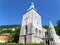 Bergen Cathedral, stunning medieval stone church against the vivid blue clear sky