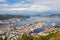 Bergen City, Scenic Aerial View Panorama harbour Cityscape under Dramatic Sky at sunset summer from Top of Mount Floyen