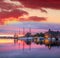 Bergen harbor with boats against colorful sunset in Norway, UNESCO World Heritage Site