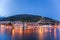 Bergen street at night with boats in Norway, UNESCO World Heritage Site