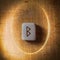 Berkano. Handmade scandinavian wooden runes on a wooden vintage background in a circle of light. Concept of fortune