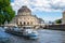 Berlin / Germany - 1 July 2018: Tourist boat passing in front of Bode Museum, located on Museum Island, on Spree river