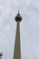 Berlin, Germany, 2018. Soaring shaft and silver sphere of Fernsehturm TV tower in Berlin