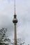 Berlin, Germany, 2018. Soaring shaft and silver sphere of Fernsehturm TV tower in Berlin