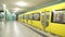 BERLIN, GERMANY - 28 JANUARY 2015: Yellow underground railway U-bahn train leaving station and camera follows the train into