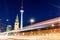 BERLIN, GERMANY - AUGUST 9, 2017: Evening view of Marienkirche (St. Mary\\\'s Church) and Fernsehturm (TV tower) with blured light o