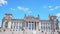 Berlin, Germany circa July, 2018: The Reichstag facade with German flags